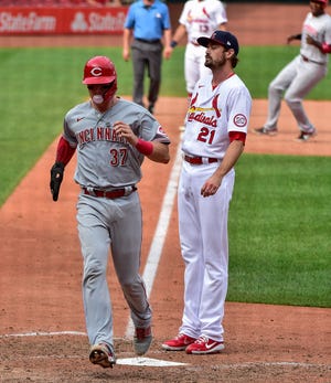 Sep 13, 2020; St. Louis, Missouri, USA;  Cincinnati Reds catcher Tyler Stephenson (37) scores on a wild pitch by St. Louis Cardinals relief pitcher Andrew Miller (21) during the seventh inning at Busch Stadium.