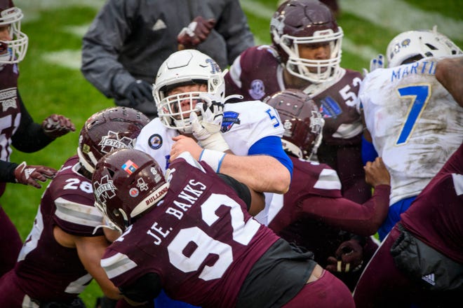 Mississippi State and Tulsa players brawl after the 2020 Armed Forces Bowl at Amon G. Carter Stadium.