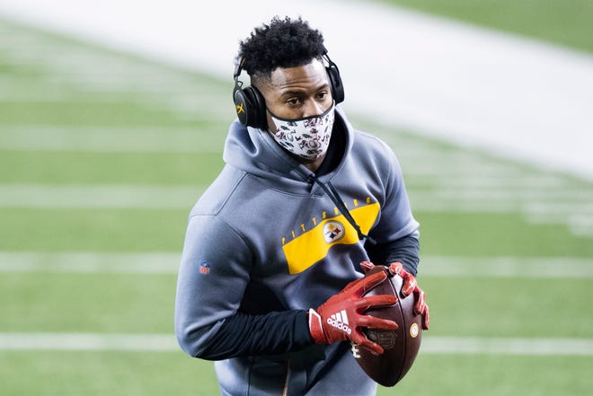 Steelers receiver JuJu Smith-Schuster in warmups prior to Monday's game at Cincinnati. He would dance on the Bengals logo, upsetting the hosts. He later fumbled in a loss.