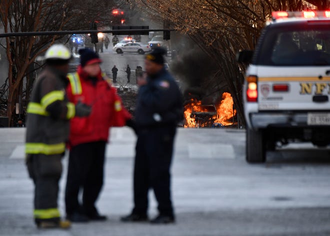 A vehicle is on fire after an explosion in the area of Second and Commerce Friday, Dec. 25, 2020 in Nashville, Tenn. 