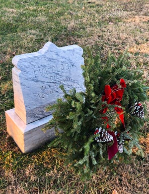 Every Christmas since Eva Clark's death in 1906, someone has left a wreath on her grave at Thornrose Cemetery in Staunton, Virginia. (Photo by Aíne Norris.)