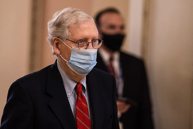 U.S. Senate Majority Leader Mitch McConnell, R-Ky., walks to open up the Senate on Capitol Hill on Dec. 20, 2020, in Washington, D.C.