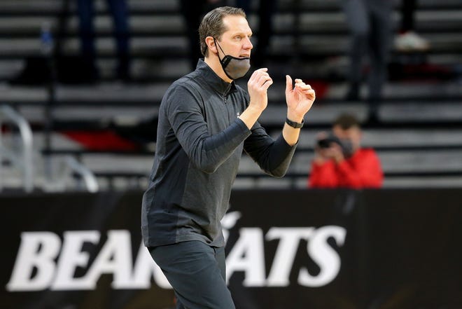 Cincinnati Bearcats men's basketball head coach John Brannen instructs his team in the first half of the 88th Crosstown Shootout college basketball game against the Xavier Musketeers at Fifth Third Arena in Cincinnati on Sunday, Dec. 6, 2020.