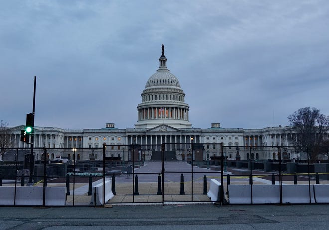 New black metal fence surrounds most of the U.S. Capitol building in Washington, D.C., two days after pro-Trump supporters stormed the Capitol. Friday, Jan. 8, 2021