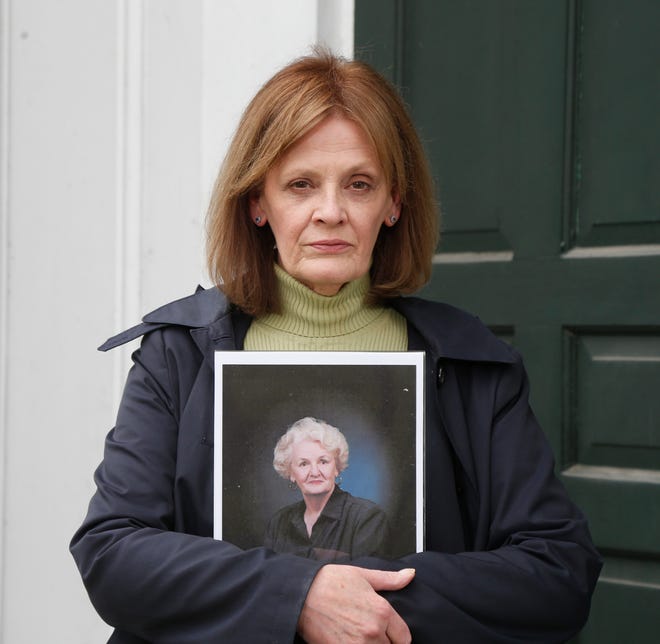 Kathleen Cole holds a portrait of her mother Dolores McGoldrick on April 29, 2020. McGoldrick succumbed to COVID-19 at Northern Dutchess Hospital on April 17 in Rhinebeck, N.Y.