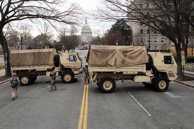 Jan 19, 2021; Washington, DC, USA; The National Guard has set up a road block at New Jersey Ave NW and E St. NW in Washington DC on Jan. 19, 2021.  Security preparations continue around the Nation's Capitol in preparation for the inauguration of President-elect Joe Biden and Vice President-elect Kamala Harris.. Mandatory Credit: Kevin Wexler-NorthJersey.com