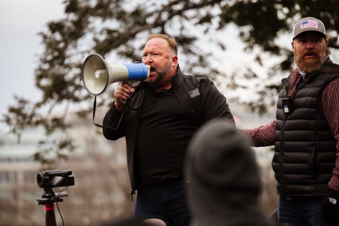 Alex Jones, the founder of right-wing media group Infowars, addresses a crowd of pro-Trump protesters after they storm the grounds of the Capitol Building on Jan. 6.