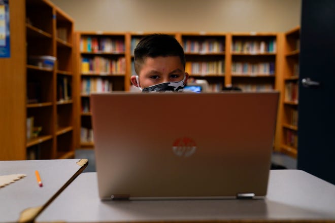 A Los Angeles Unified School District student attends an online class at the Boys and Girls Club of Hollywood on Aug. 26. The facility is open for children whose parents must leave home to work. There is no charge. Snacks and lunch are provided.