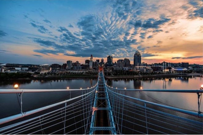 Isaac Wright image of the Cincinnati morning skyline from the top of the John A. Roebling Suspension Bridge.