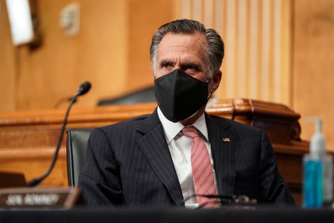 Sen. Mitt Romney (R-UT) wears two protective masks while questioning Alejandro Mayorkas, nominee to be Secretary of Homeland Security, during a Senate Homeland Security and Governmental Affairs confirmation hearing on Capitol Hill on Jan. 19, 2021 in Washington, DC. 