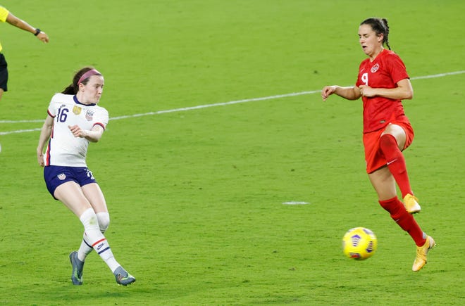 United States midfielder Rose Lavelle (16) kicks the ball into the net for the game-winning goal past Canada forward Evelyne Viens (9) during the second half of a She Believes Cup soccer match at Exploria Stadium in Orlando on Feb. 18.