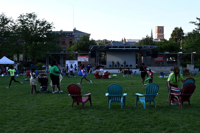 Lawn chairs are setup for patrons of Summer Cinema on Wednesday, June 16, 2021 at Washington Park. Summer Cinema gives the Cincinnati community a place to gather and enjoy a free movie screening and listen to a discussion about themes present in the movie.