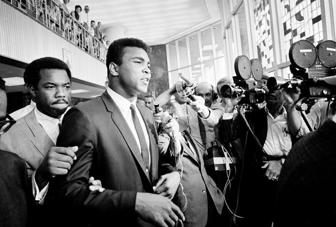 Muhammad Ali was convicted of draft evasion - and immediately stripped of his heavyweight title - in 1967, after refusing to be inducted into the U.S. Army, citing religious reasons. His conviction was later overturned.