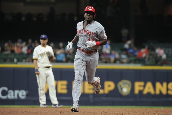 Jun 14, 2021; Milwaukee, Wisconsin, USA;  Cincinnati Reds left fielder Aristides Aquino (44) rounds the bases on a three run home run against the Milwaukee Brewers in the ninth inning at American Family Field. Mandatory Credit: Michael McLoone-USA TODAY Sports