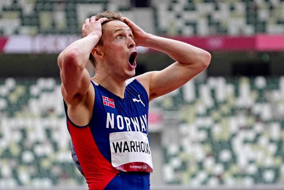 Karsten Warholm (NOR) celebrates winning the gold medal men's 400m hurdles final during the Tokyo 2020 Olympic Summer Games at Olympic Stadium.