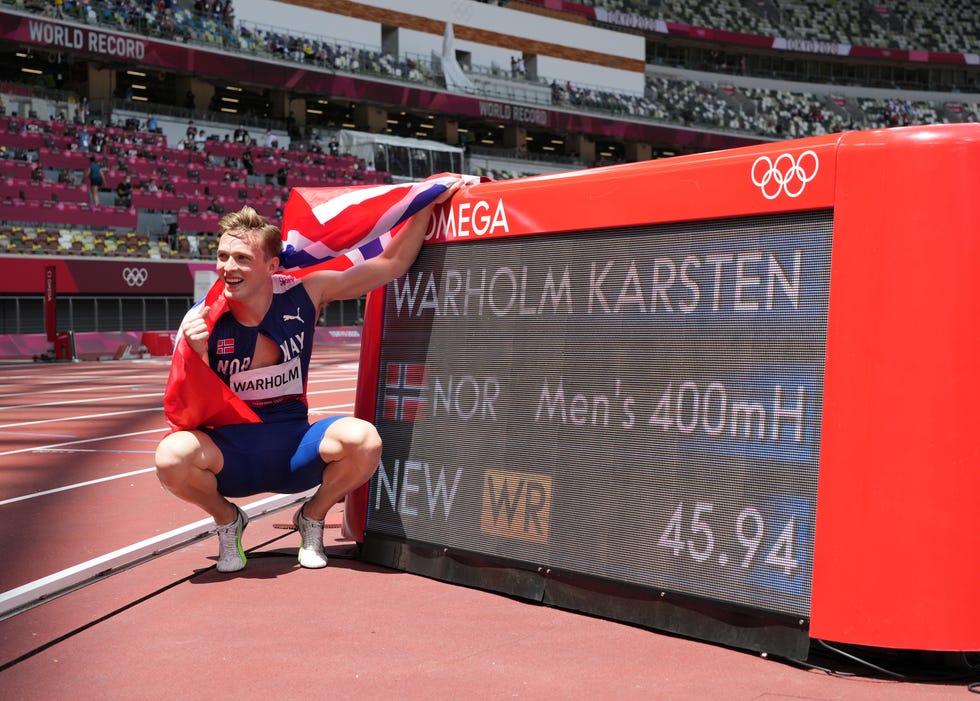Karsten Warholm (NOR) celebrates his world record victory in the men's 400m hurdles final during the Tokyo 2020 Summer Olympic Games at Olympic Stadium. 