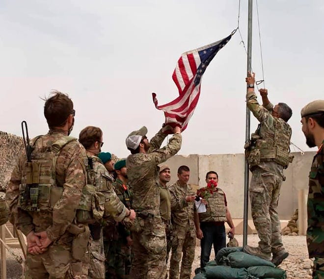 American and Afghan soldiers attend a handover ceremony from the U.S. Army to the Afghan National Army in Helmand province on May 2, 2021.