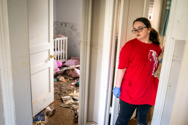 Vanessa Yates checks the damage inside of her home in Waverly, Tenn., Sunday, Aug. 22, 2021. Fifteen inches of rainfall caused substantial flooding in the Humphreys County city.