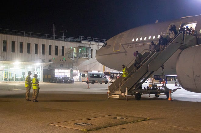 In a photo from Aug. 16, 2021, provided by the British Ministry of Defence, the first flight carrying evacuated personnel of British Embassy staff and various British Nationals, arriving from Kabul at RAF Brize Norton in England.