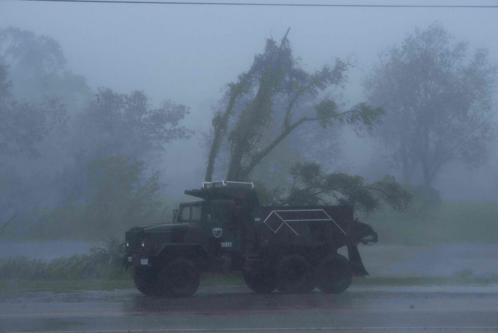 A truck is seen in heavy winds and rain from hurricane Ida in Bourg, Louisiana on Aug. 29, 2021. Hurricane Ida struck the coast of Louisiana Sunday as a powerful Category 4 storm, 16 years to the day after deadly Hurricane Katrina devastated New Orleans.