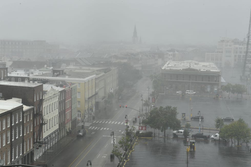 Rain batters North Peters Street in New Orleans, Louisiana, with St. Louis Cathedral visible in the distance (back L) on August 29, 2021 after Hurricane Ida made landfall.