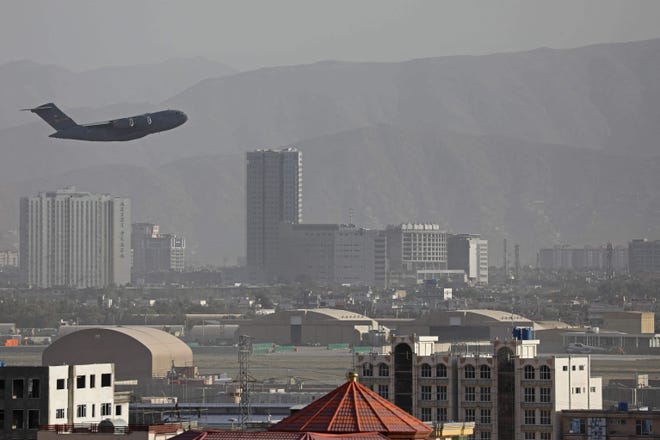 A US Air Force aircraft takes off from the military airport in Kabul on Aug. 27, 2021, as the Pentagon said the evacuation of tens of thousands of people from Afghanistan still faces more possible attacks like the bombing that killed scores of people outside the Kabul airport.