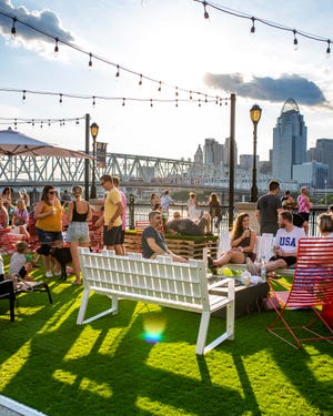 An artist concept shows what an outdoor patio will be like at a planned Cuban and Latina American fusion restaurant and rum bar Amador shows an Ohio River vista featuring the Downtown skyline from Newport on the Levee.