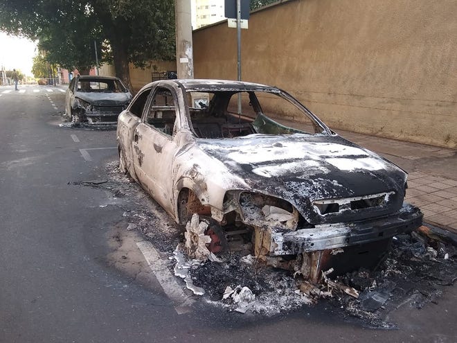 Cars were burned during a bank robbery in Aracatuba, Brazil, on Aug. 30. A heavily armed group of bank robbers wreaked havoc across the southeastern Brazilian city, striking three banks, setting fire to vehicles and tying hostages to their getaway cars in an assault that left at least three people dead, officials say.