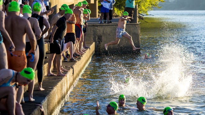 Swimmers start at the Serpentine Wall on Sunday, Sept. 24, 2017, to participate in the Bill Keating, Jr. Great Ohio River Swim.