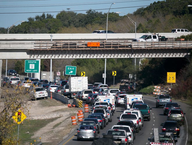 A committee of Rollingwood residents recently attended a meeting of Texas Department of Transportation and Austin officials to discuss how to minimize traffic jams such as this work  on the pedestrian/bike bridge at MoPac and Loop 360 as the MoPac expansion project continues. DEBORAH CANNON / AMERICAN-STATESMAN12/22/'15Austin