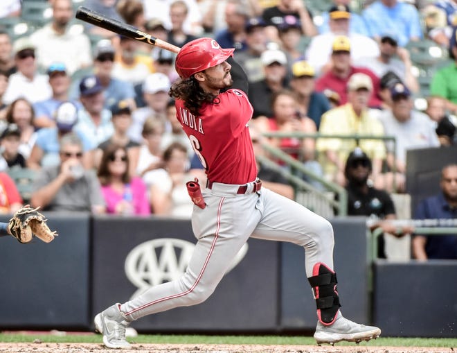 Aug 26, 2021; Milwaukee, Wisconsin, USA; Cincinnati Reds second baseman Jonathan India (6) hits a three run homer in the fifth inning against the Milwaukee Brewers at American Family Field. Mandatory Credit: Benny Sieu-USA TODAY Sports