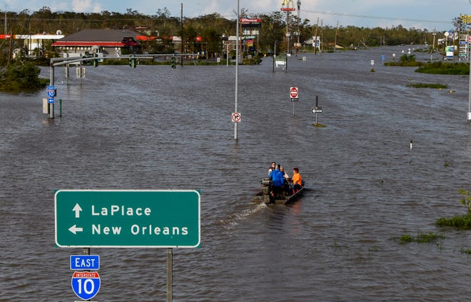 Highway 51 is flooded near LaPlace, La., on Monday morning Aug. 30, 2021, after Hurricane Ida came ashore in Louisiana on Sunday Aug. 29, 2021.
