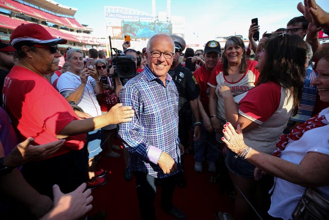 Cincinnati Reds Hall of Fame broadcaster Marty Brennaman shakes hands with fans during postgame ceremonies on his last day before he retires after 46 years in the booth, Thursday, Sept. 26, 2019, at Great American Ball Park in Cincinnati.