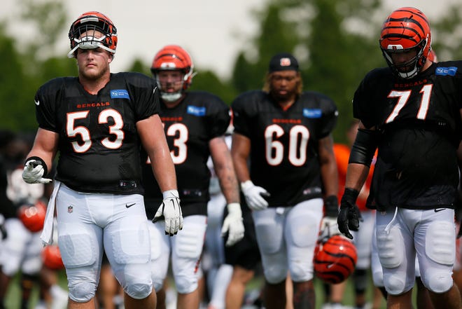 Cincinnati Bengals center Billy Price (53) and offensive line walk between fields during a training camp practice at the Paul Brown Stadium practice facility in downtown Cincinnati on Wednesday, Aug. 11, 2021.