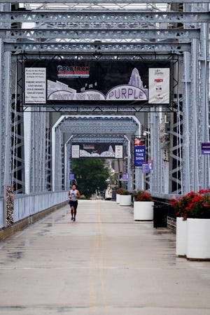 Jake Oswald, of Newport, Kentucky, runs along the Purple People Bridge. Access to the bridge reopened on the Kentucky entrance July 1, but the Ohio entrance remains closed.