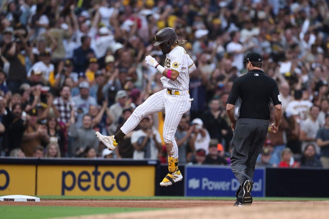 San Diego Padres' Fernando Tatis Jr. celebrates as he runs the bases on a solo home run against the Cincinnati Reds during the sixth inning of a baseball game Thursday, June 17, 2021, in San Diego. (AP Photo/Derrick Tuskan)