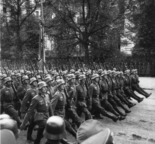 Nazi soldiers march through Warsaw.