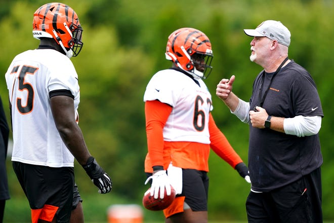 Cincinnati Bengals offensive line coach Frank Pollack instructs the unit during training camp practice, Monday, Aug. 16, 2021, at the practice fields next to Paul Brown Stadium in Cincinnati.