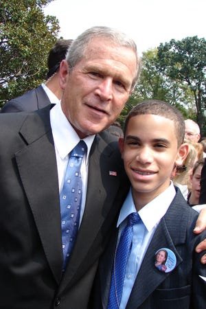 President Bush and  12-year-old Kevin Villa pose after Friday's White House ceremony to award the 9/11 Heroes Medal of Valor. The photo was taken by Yamel's mother/Kevin's grandmother, Ana Jager.