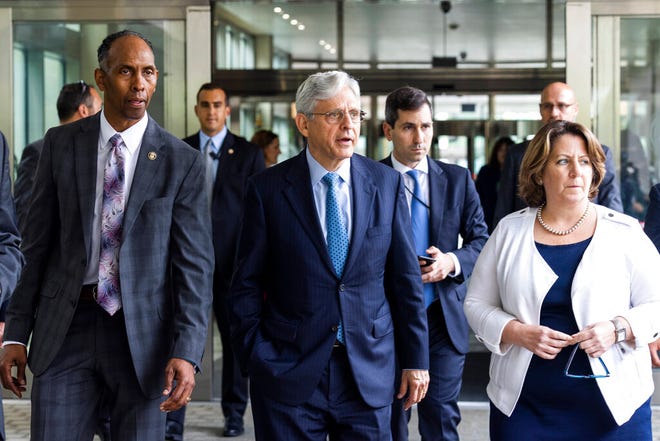 Attorney General Merrick Garland, center, along with Deputy Attorney General Lisa Monaco, right, and Acting Alcohol, Tobacco and Firearms (ATF) Director Marvin G. Richardson, left, leaves the Bureau of Alcohol, Tobacco and Firearms headquarters in Washington, Thursday, July, 22 2021.