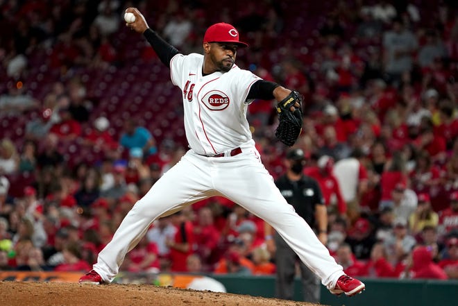 Cincinnati Reds relief pitcher Mychal Givens (48) delivers in the sixth inning of a baseball game against the Detroit Tigers, Friday, Sept. 3, 2021, at Great American Ball Park in Cincinnati. 