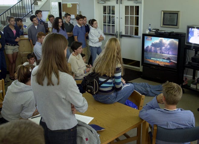 September 11, 2001: In the school library at Seven Hills School on Red Bank Road, students watch coverage of the attack on the World Trade Center in New York City.