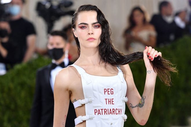 Fashion sure is one way to make a statement — and Cara Delevingne didn't mince words with her outfit from Christian Dior.