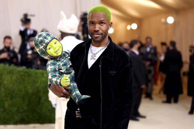 Singer Frank Ocean brought a special guest with him to the Met Gala: a lime green, robot baby to match his green hair.