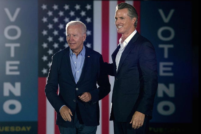 California Gov. Gavin Newsom greets President Joe Biden during a campaign event in Long Beach on Monday night.