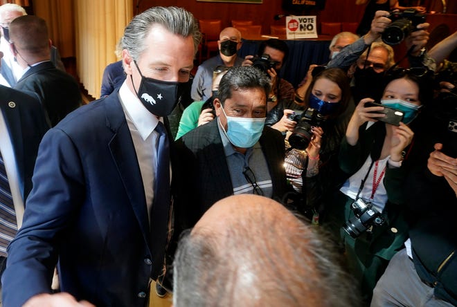Gov. Gavin Newsom greets supporters after speaking to volunteers in San Francisco on Tuesday.