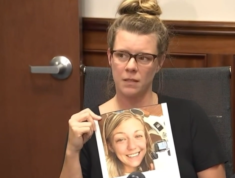 Nichole Schmidt holds photo of missing daughter Gabby Petito