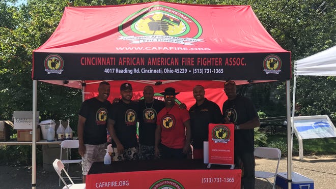 The Cincinnati African American Firefighter Association booth is pictured here at the Black Family Reunion. The firefighters work with the city health department to promote COVID-19 vaccination. Pictured are: Greg Phelia, Damonte Brown, Darrell Bullock, Keno Henry, William West III, and Duane Williams.
