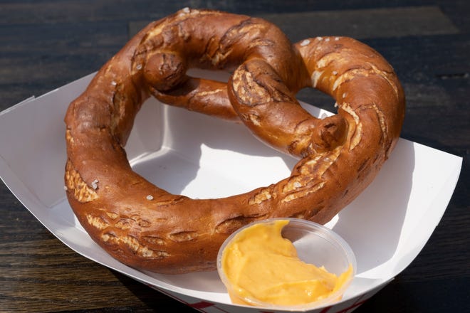 Pretzel with horseradish cheese from The Lubecker is photographed at the opening day of Oktoberfest Zinzinnati in downtown Cincinnati, Ohio on Friday, Sept. 20, 2019.
