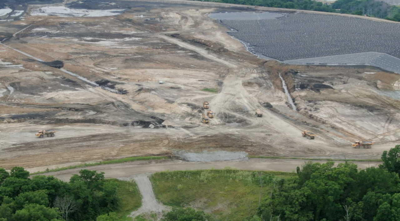 Truckloads of coal ash is being moved to the landfill at Ghent Generating Station